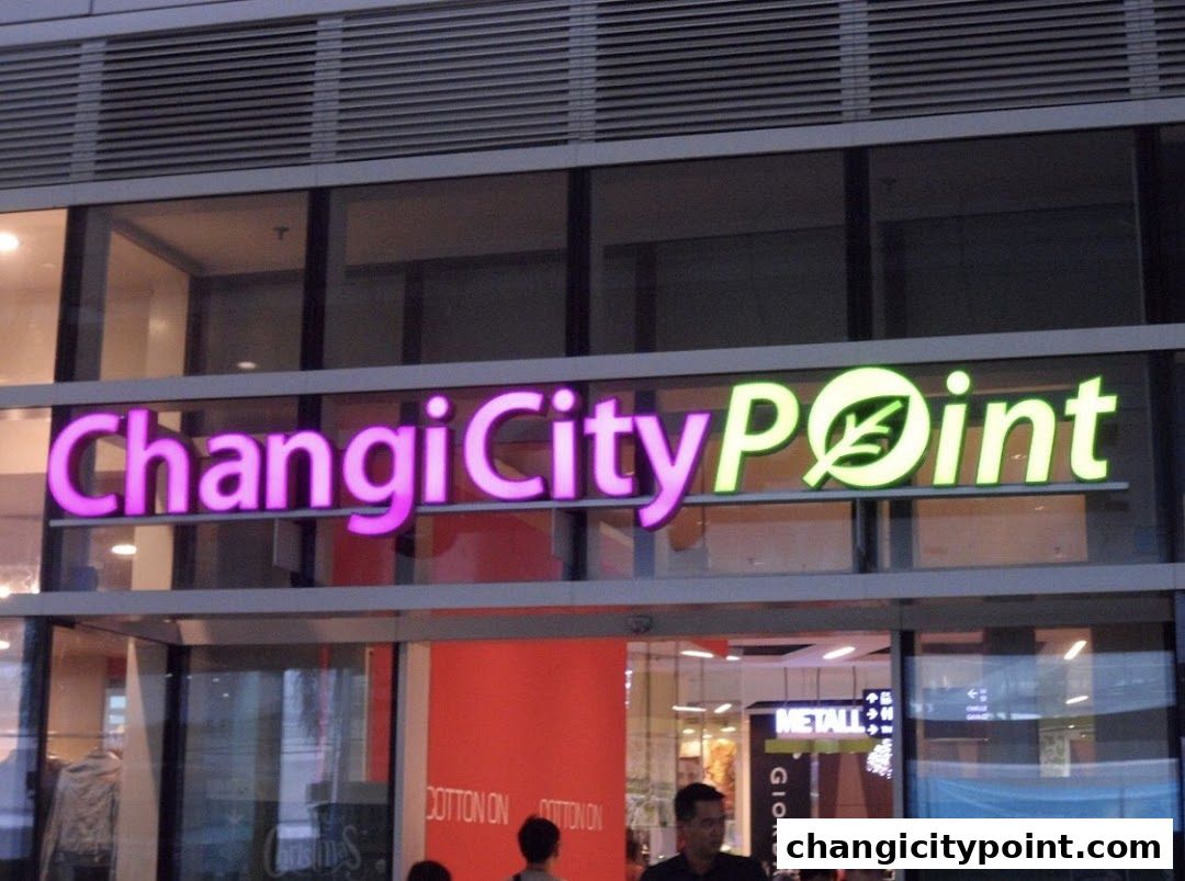 The illuminated sign for Singtel Exclusive Retailer - Changi City Point.