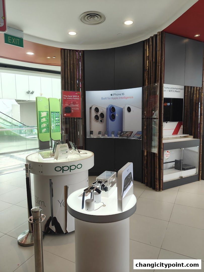 Interior of a Singtel store showcasing Oppo and Apple products.
