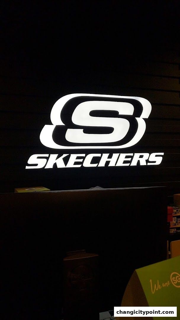 The Skechers logo is illuminated against a dark background.