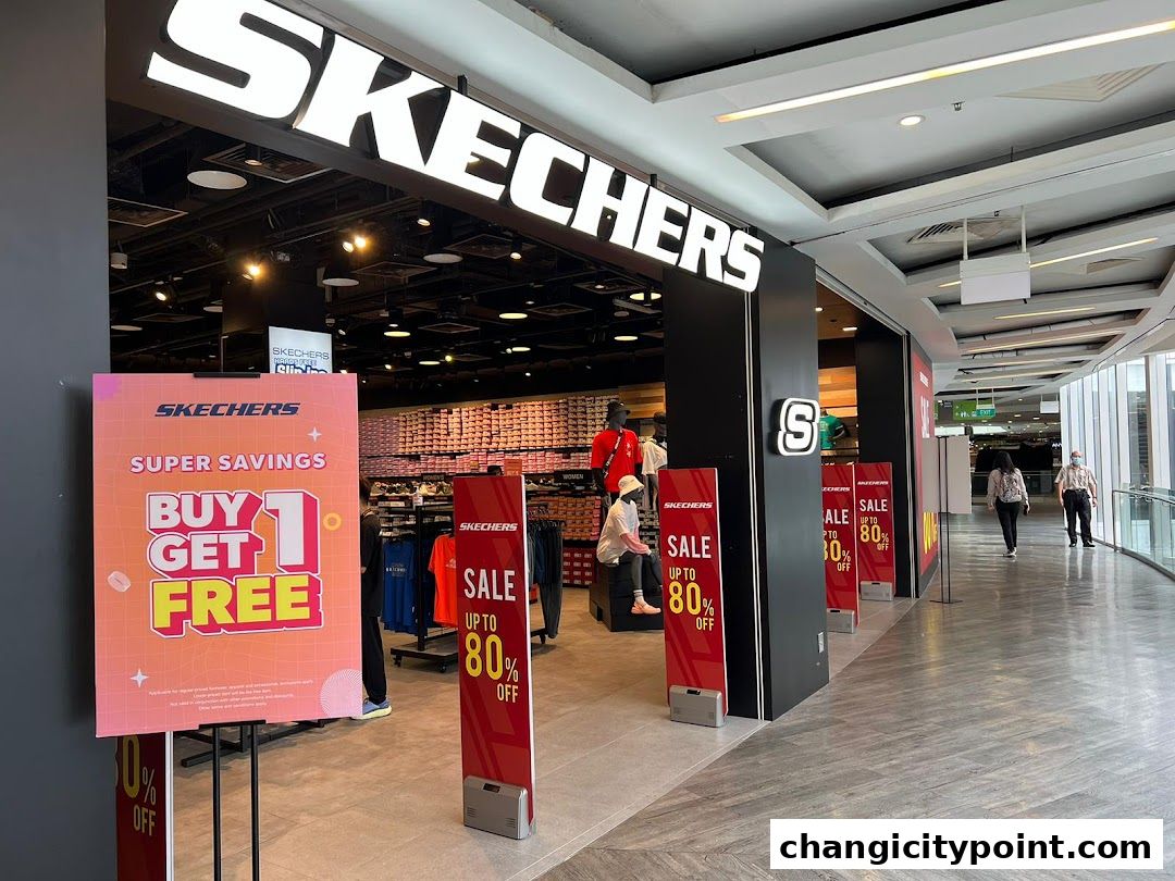 Skechers store front with sale signs and displays of shoes and apparel.