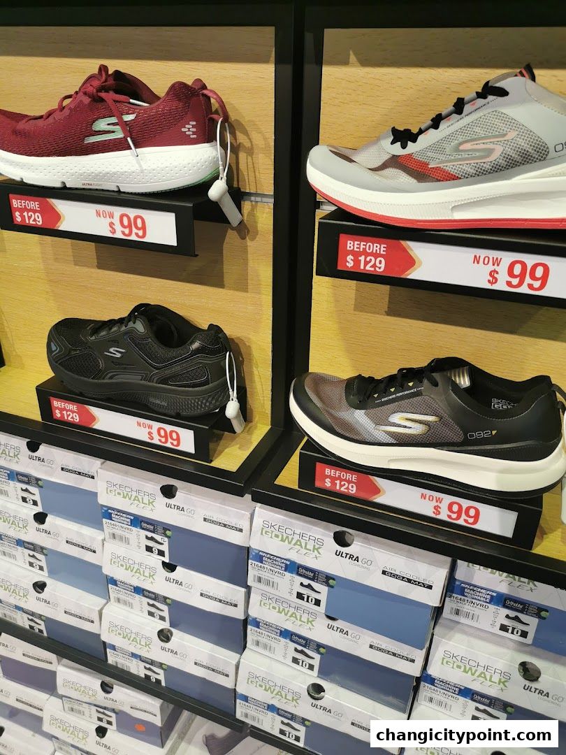 Display of Skechers shoes on shelves with sale prices marked.