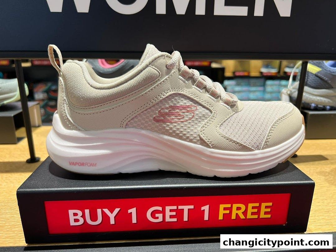 A beige Skechers women's shoe displayed with a 'Buy 1 Get 1 Free' promotion.