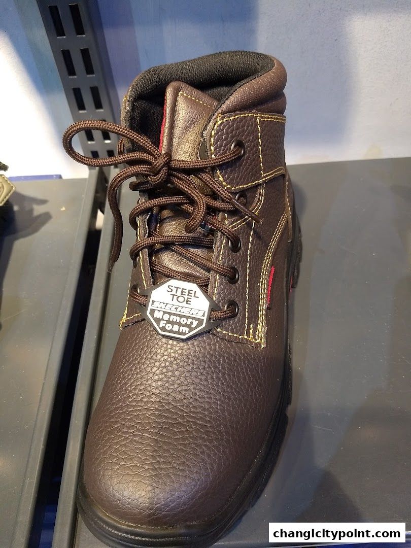 A close-up of a brown Skechers steel toe work boot with memory foam.