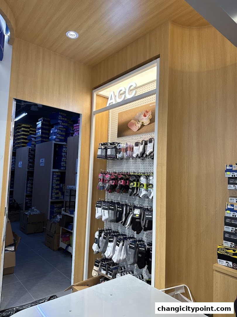 Interior view of Skechers Outlet Changi City Point, showcasing socks and shoe boxes.