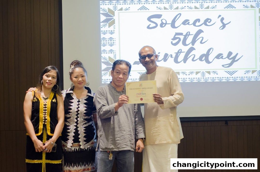 People posing for a photo at Solace Asia's 5th birthday celebration.