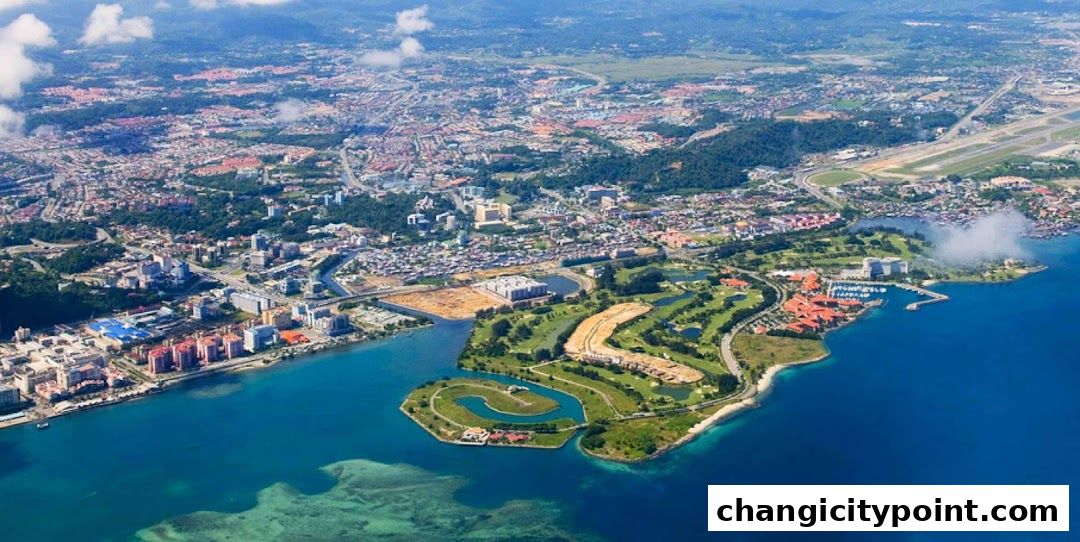 Aerial view of a coastal city with a golf course and marina.