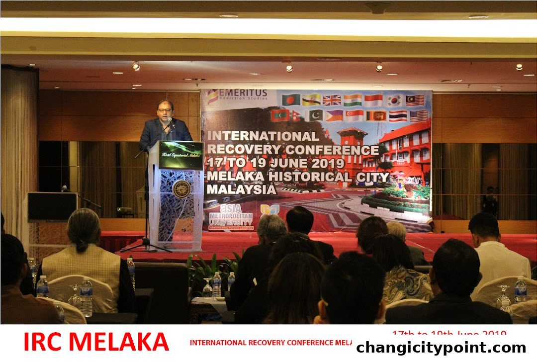 A speaker presents at the International Recovery Conference in Melaka, Malaysia.
