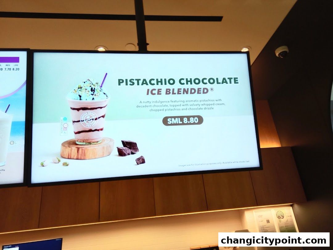 A digital menu board displays a Pistachio Chocolate Ice Blended drink.