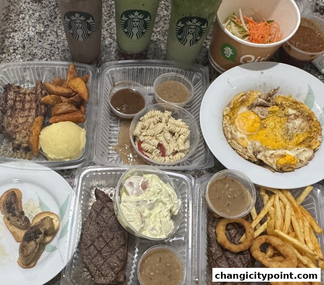 A spread of takeout food including steaks, fries, pasta salad, and Starbucks drinks.