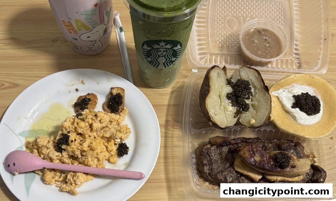 A meal featuring scrambled eggs, steak, baked potato, and a Starbucks drink.