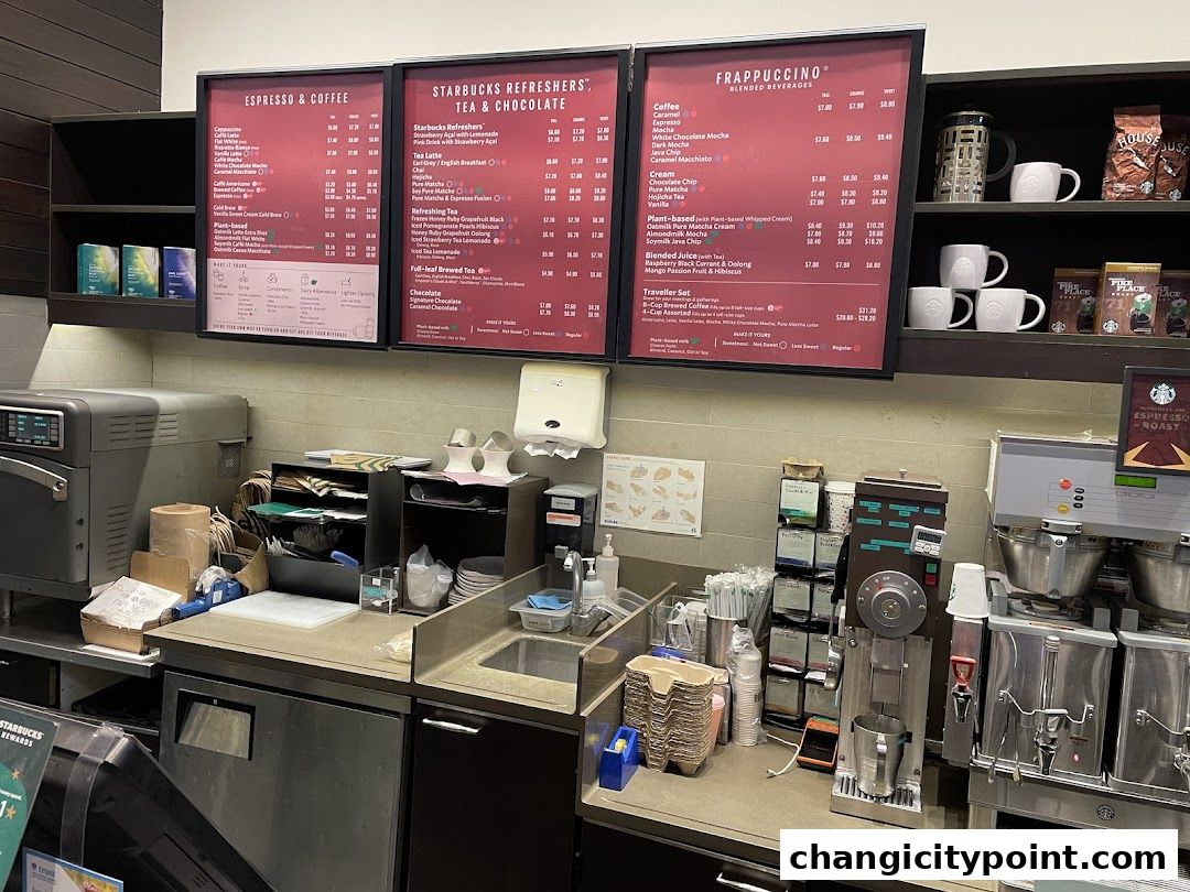 Starbucks menu boards displaying espresso, refreshers, tea, chocolate, and Frappuccino beverages.