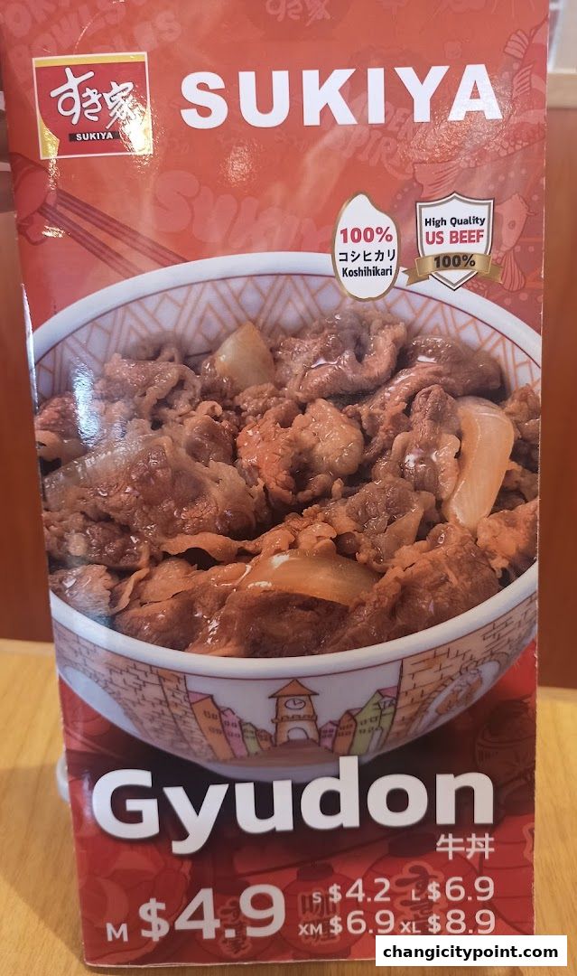 A close-up of a Sukiya Gyudon bowl with prices and sizes displayed.