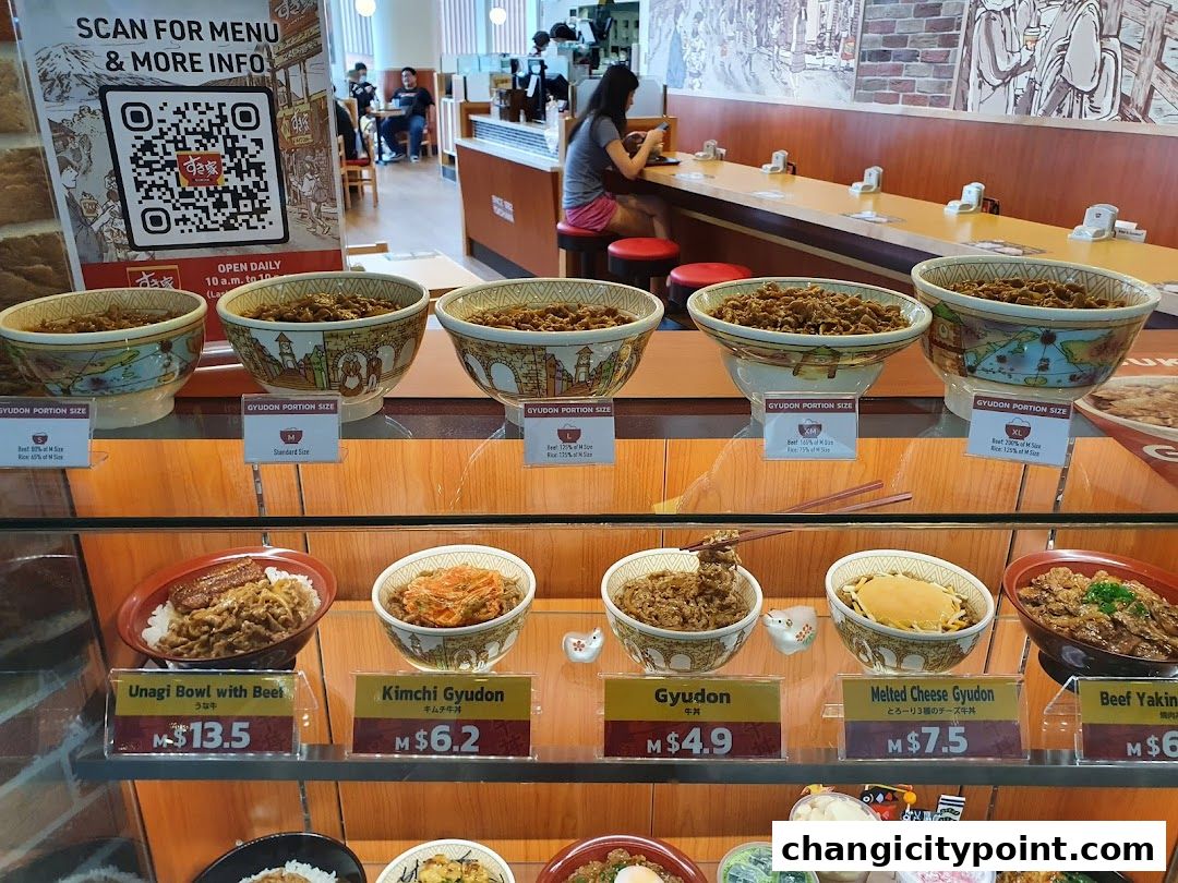 Display of various gyudon bowls and other Japanese rice dishes at Sukiya.
