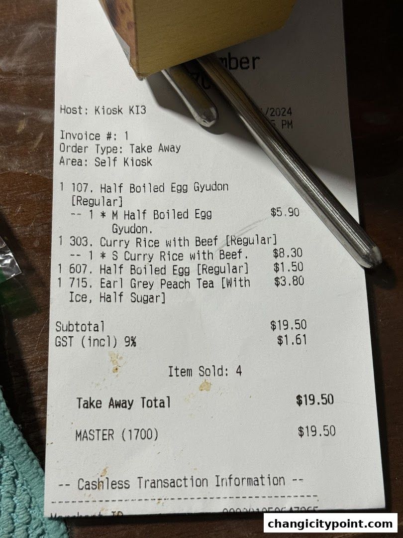 A receipt from Sukiya Gyudon Curry showing food and drink items purchased.