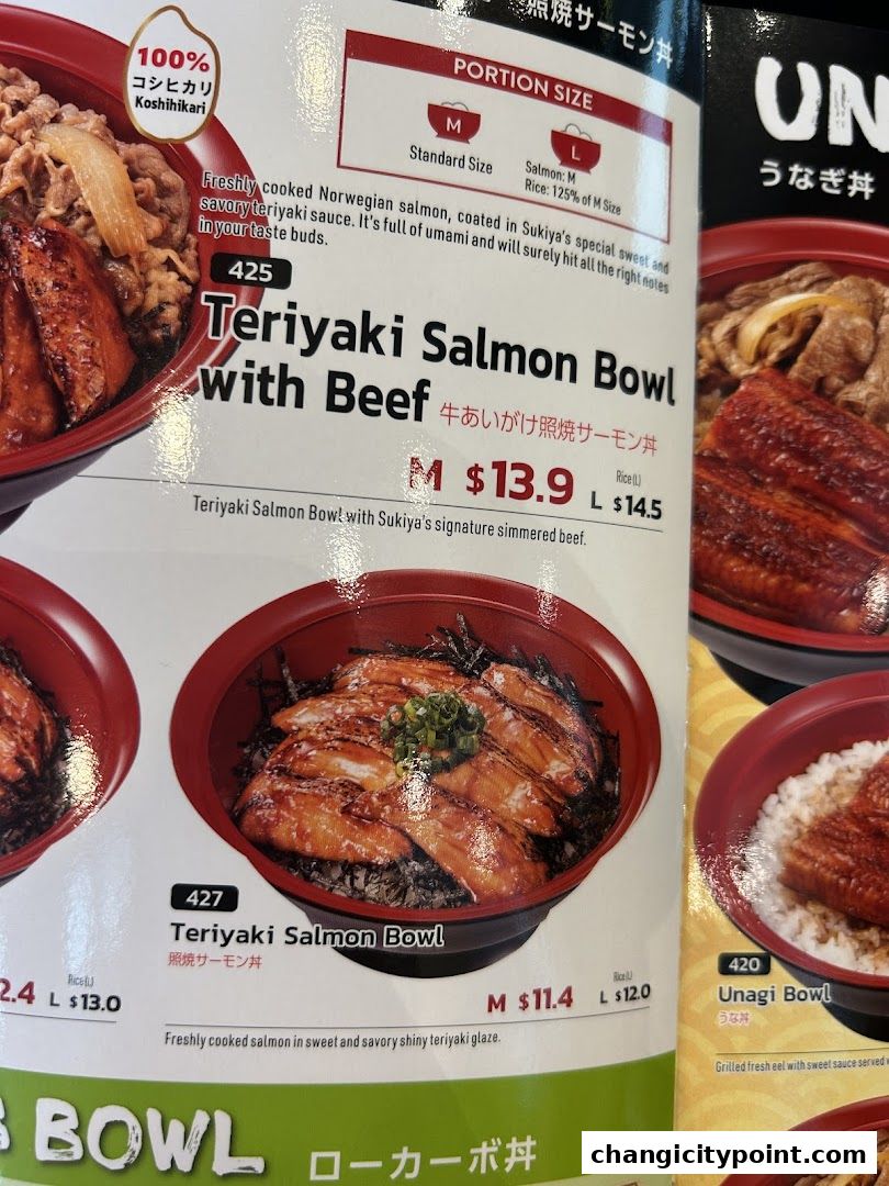 A close-up of a Sukiya menu featuring Teriyaki Salmon Bowls and Unagi Bowls.
