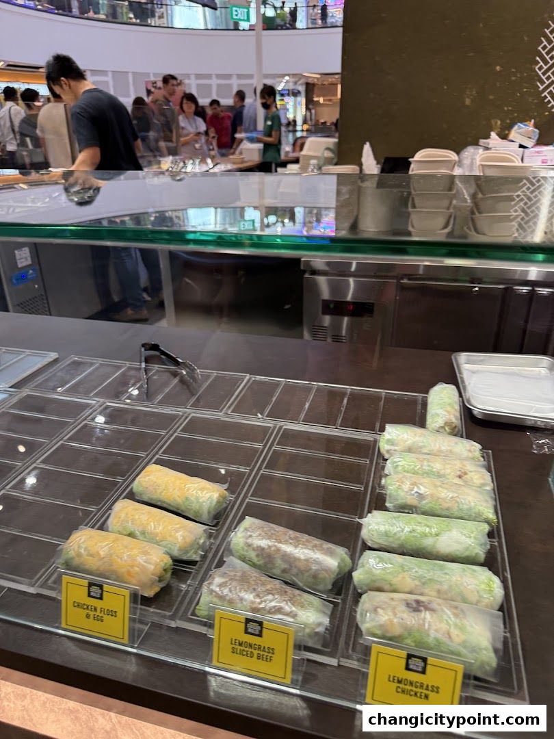 Freshly made spring rolls displayed in a chilled counter at Supergreen Changi City Point.