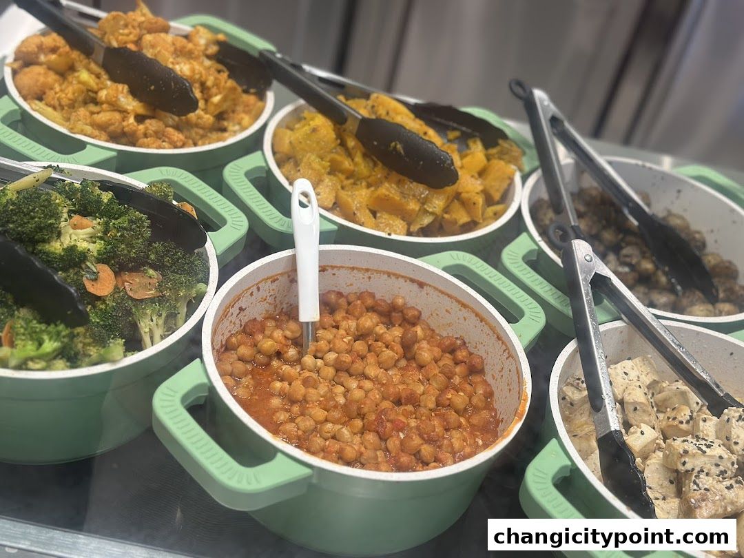 A selection of healthy, freshly prepared dishes in serving bowls with tongs.
