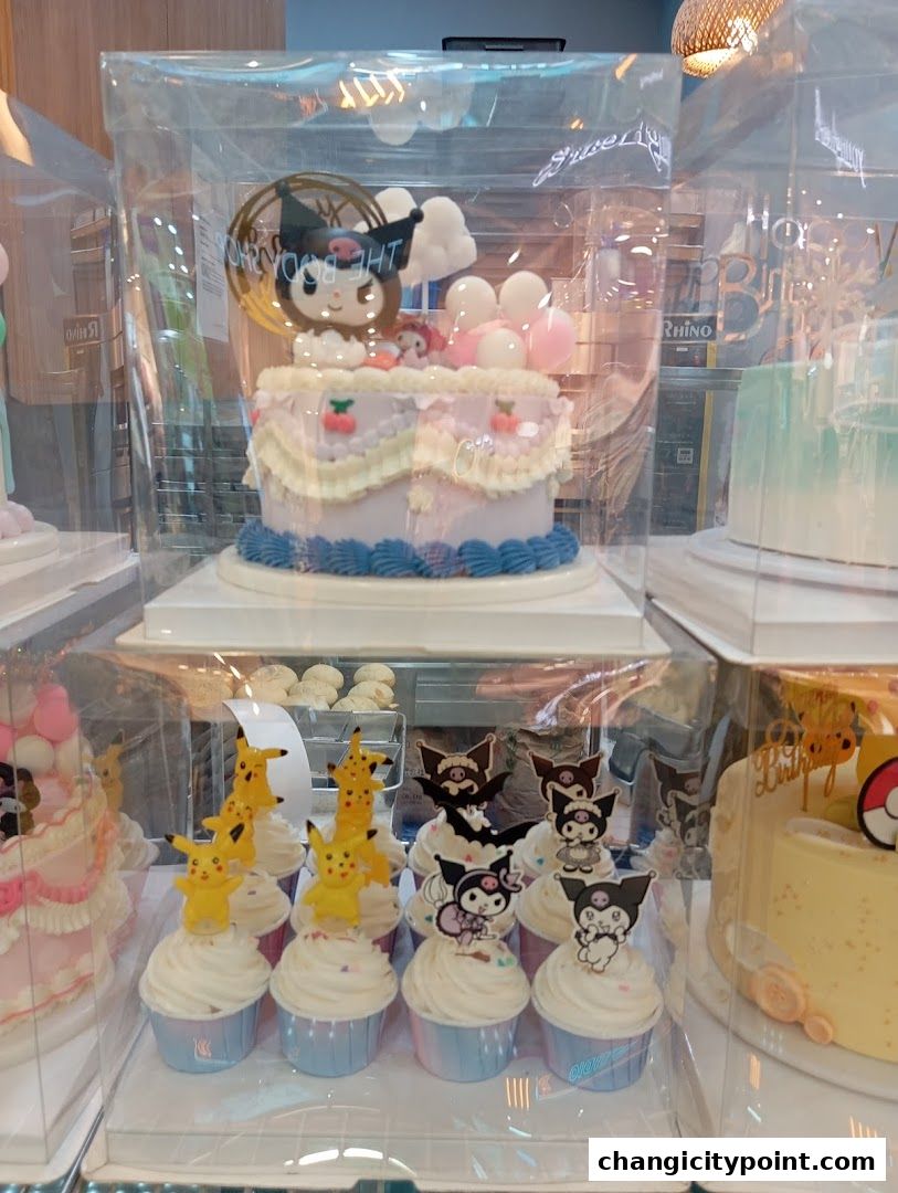 A display of beautifully decorated cakes and cupcakes with popular character themes.
