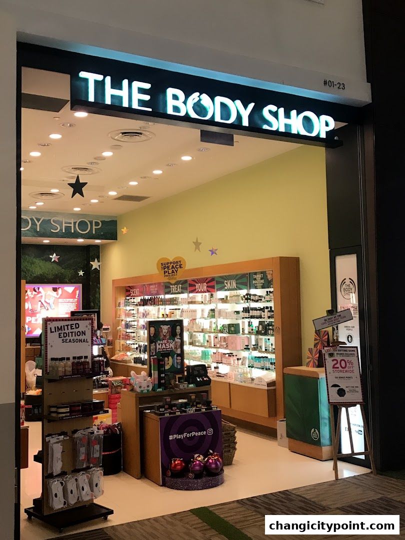 The Body Shop storefront with products displayed inside and promotional signage.