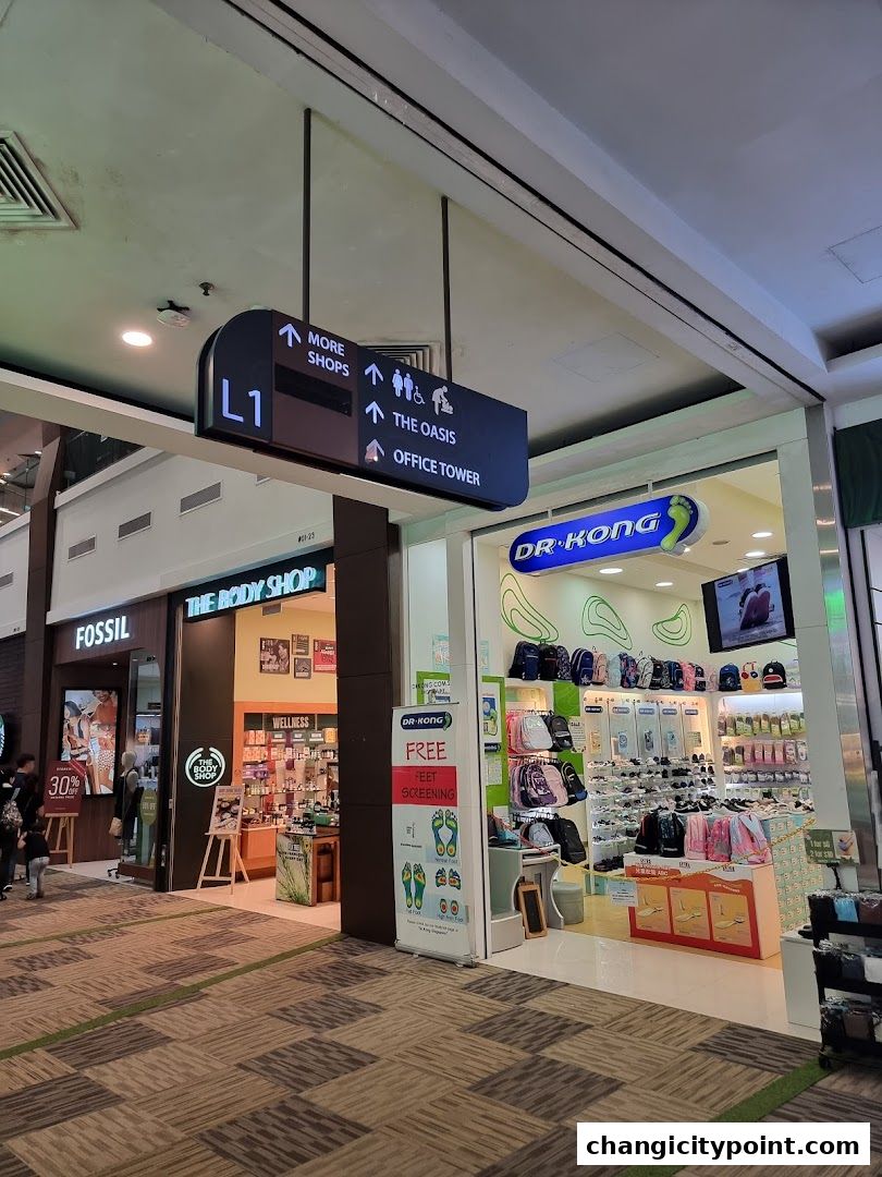 The Body Shop store entrance with displays of wellness products and signage.
