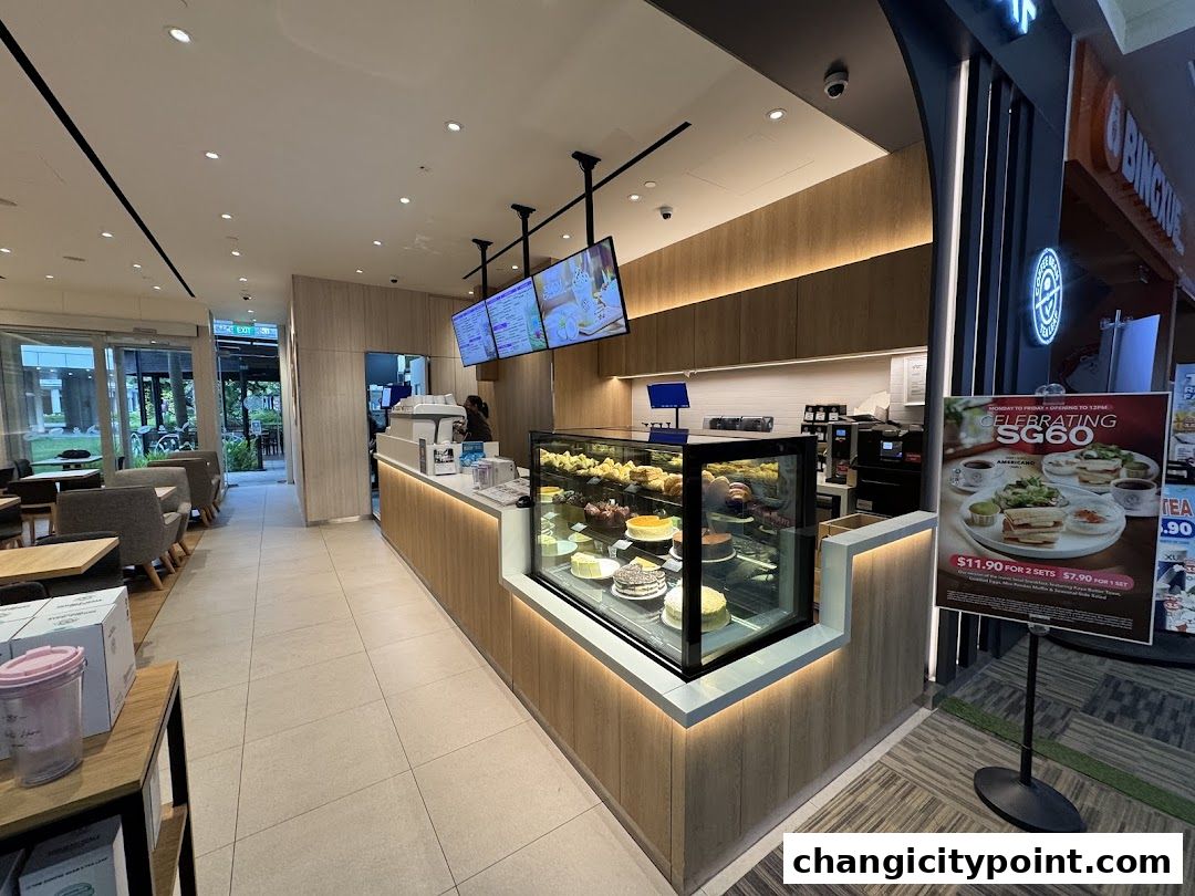 Interior view of The Coffee Bean Tea Leaf cafe with display cases and seating area.