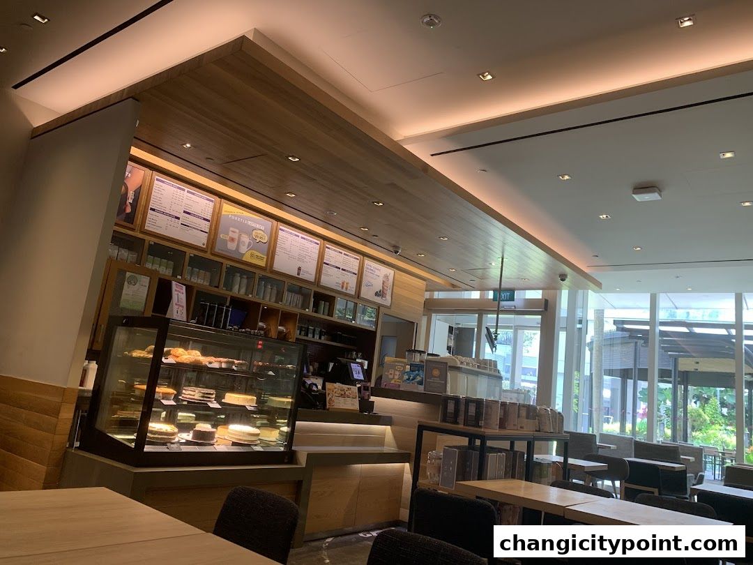 Interior view of The Coffee Bean & Tea Leaf cafe with display cases and seating areas.