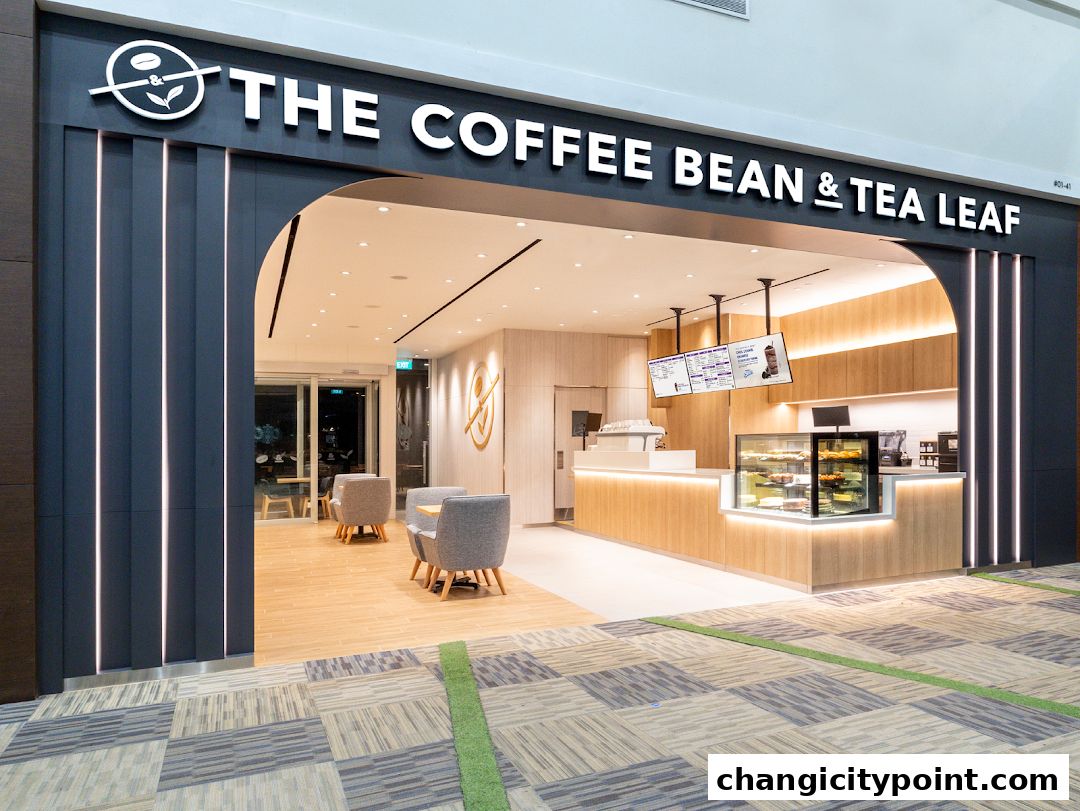 Exterior view of The Coffee Bean & Tea Leaf shop with seating area and counter.
