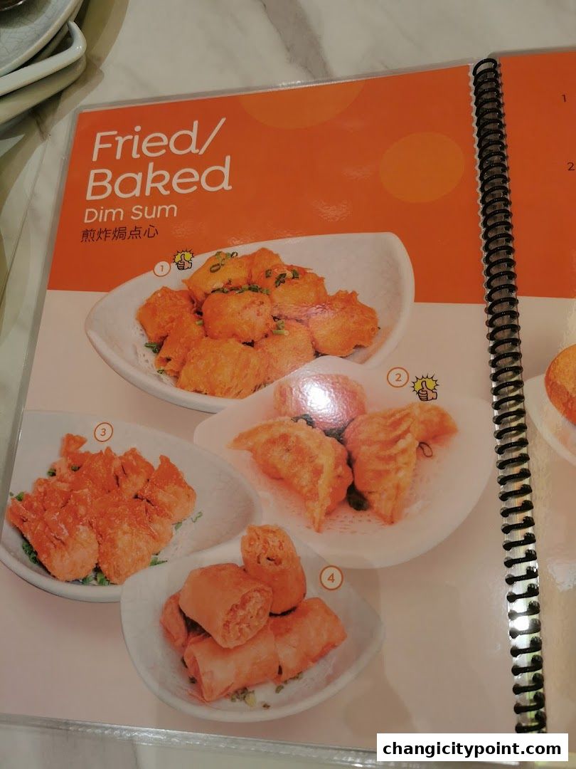 A menu page showcasing various fried and baked dim sum dishes.