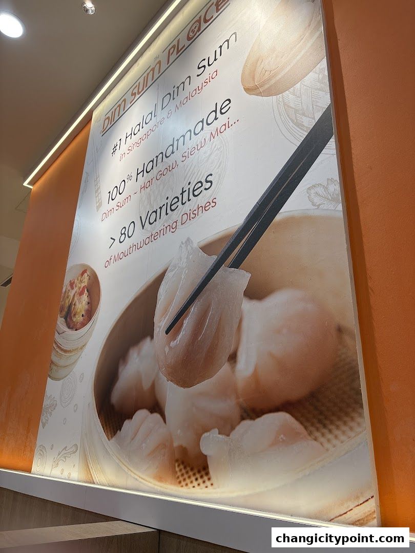 A large wall graphic advertising The Dim Sum Place, highlighting handmade dim sum and variety.