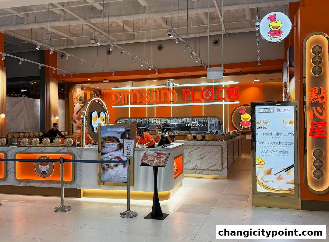 The Dim Sum Place shop front with bright orange accents and a display of dim sum.