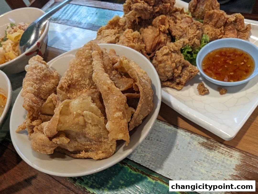 Crispy fried chicken and chicken skin served with a sweet chili dipping sauce.