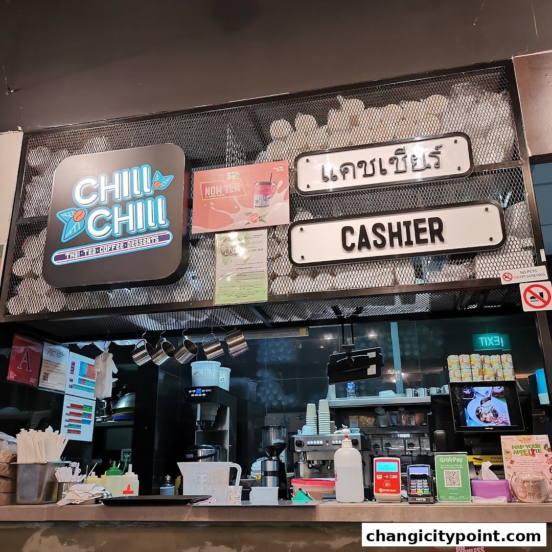 The counter area of a shop with a 'Chill Chill' logo, cashier sign, and coffee machines.