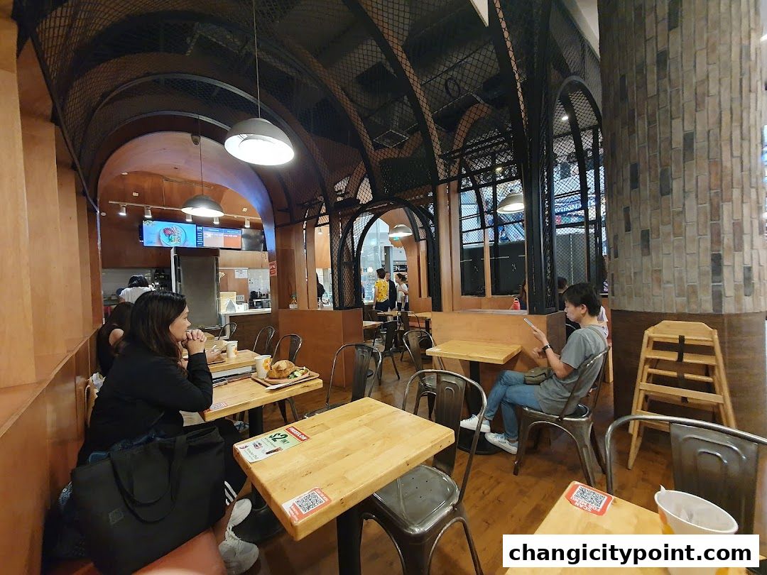 Interior view of The Soup Spoon Union restaurant with diners seated at tables.