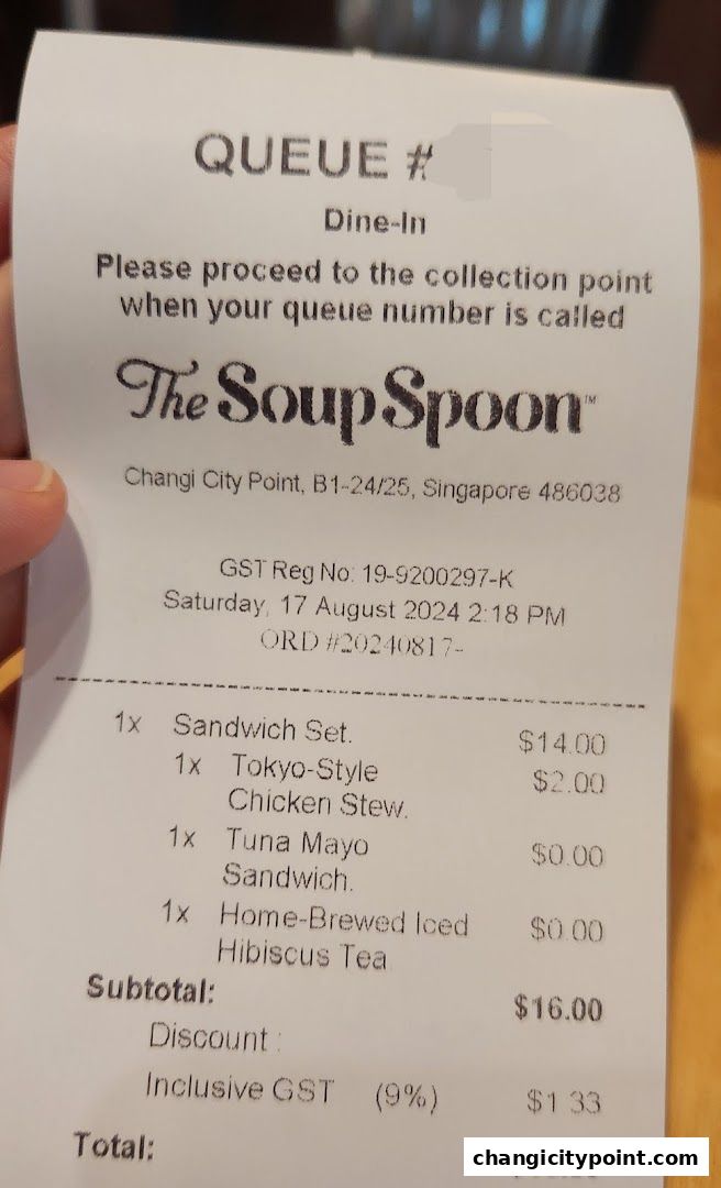 A receipt from The Soup Spoon showing a dine-in order with items and prices.