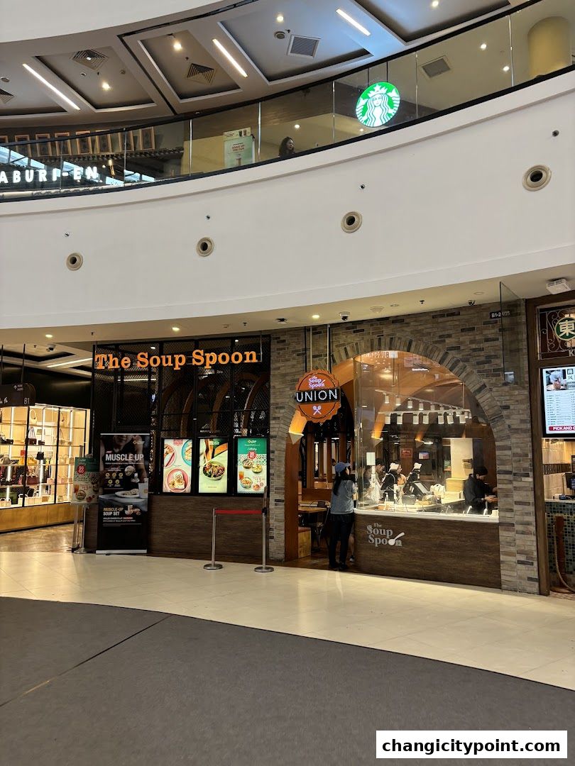 The Soup Spoon Union shop front with an arched entrance and menu displays.