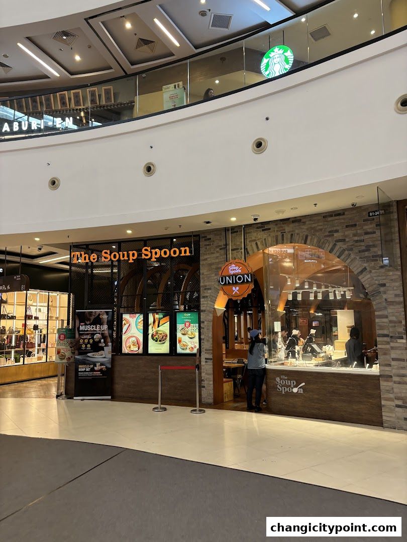 The Soup Spoon Union shop front with menu displays and an arched entrance.