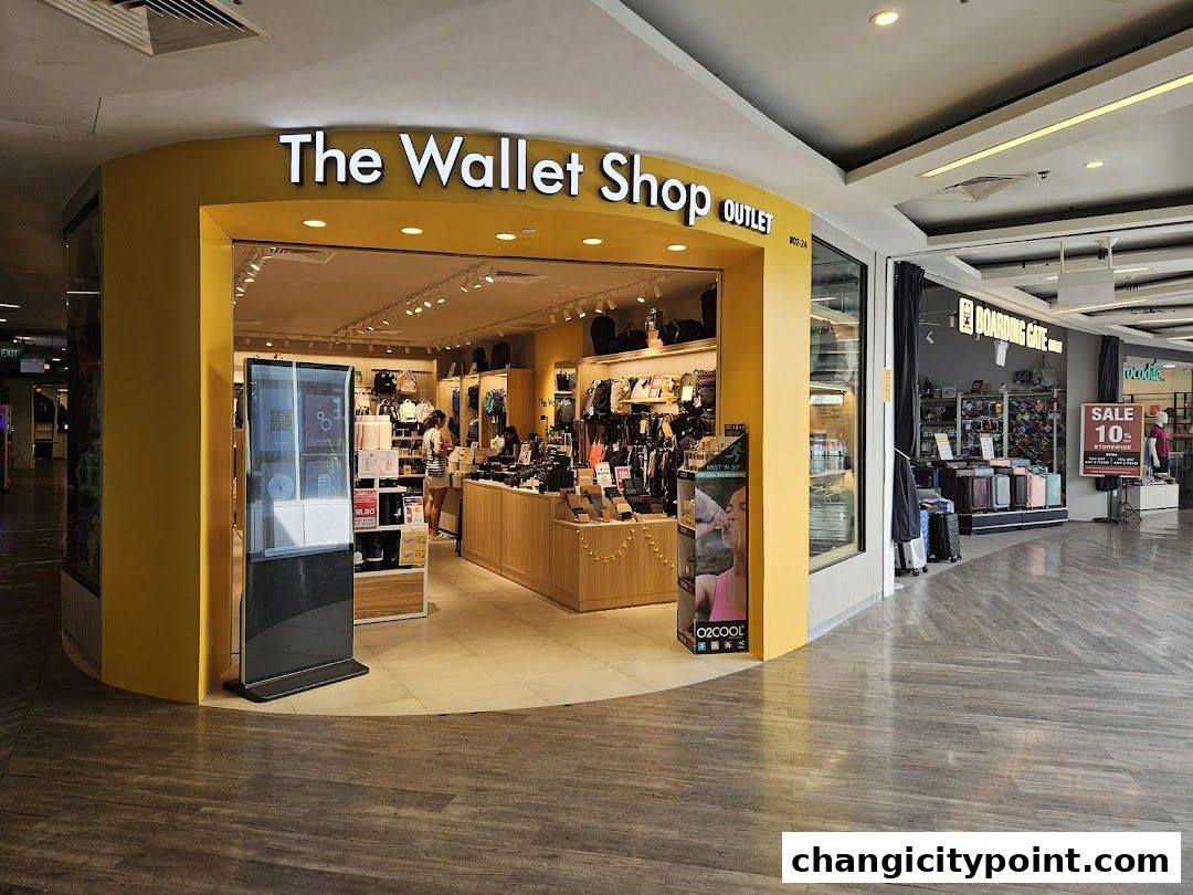 The exterior of 'The Wallet Shop - Changi City Point' outlet, showcasing wallets and accessories.