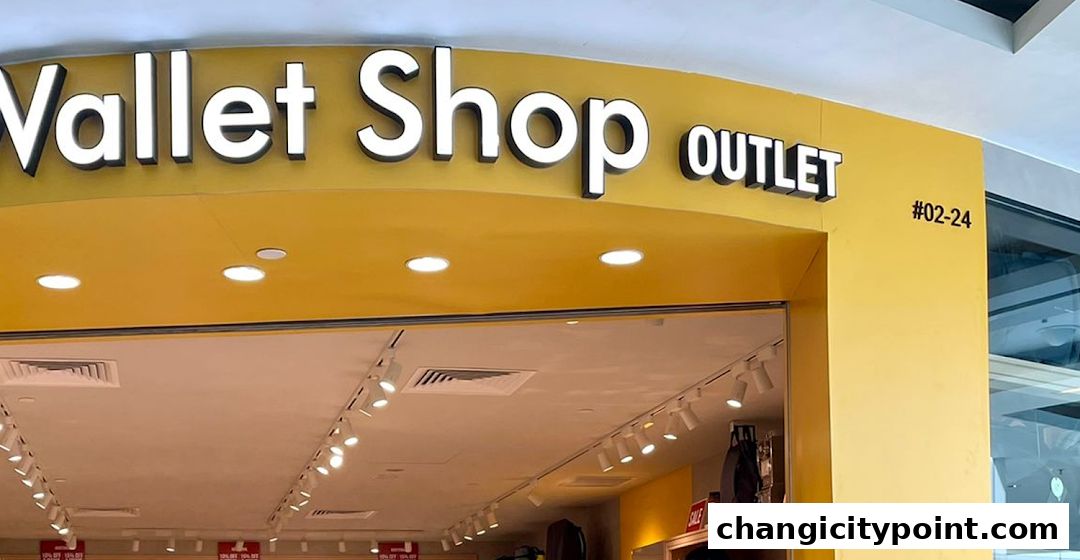 The exterior of The Wallet Shop outlet with a bright yellow facade and illuminated signage.