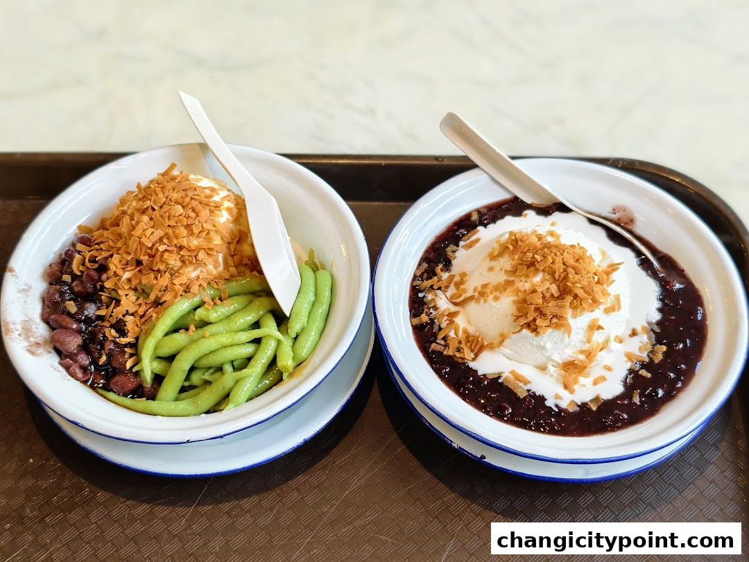 Two bowls of dessert with ice cream, red beans, green jelly, and coconut flakes.