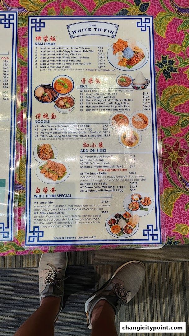 A menu from The White Tiffin restaurant featuring Nasi Lemak, Rice dishes, Noodles, and specials.