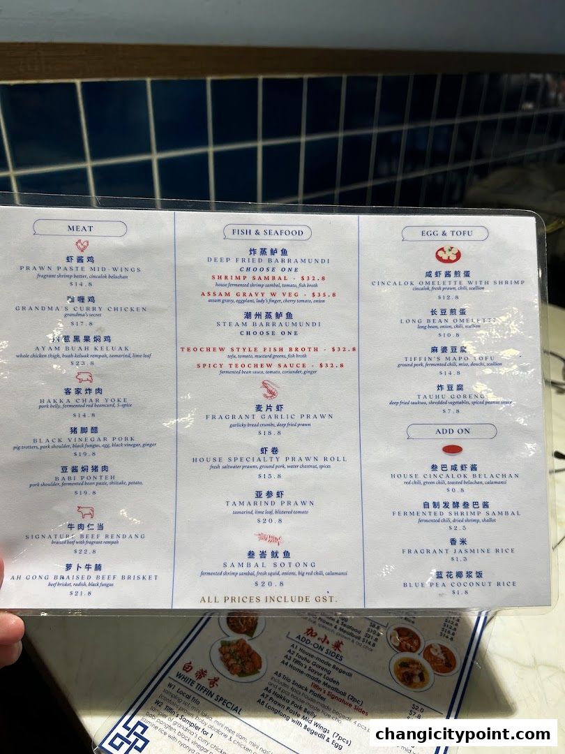 A menu from The White Tiffin Changi City Point with various meat, seafood, and tofu dishes.