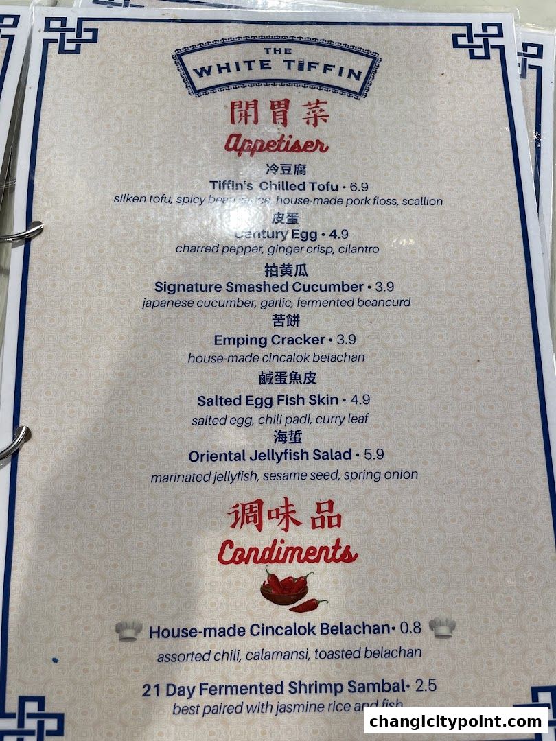 A menu from The White Tiffin featuring appetizers and condiments with prices.
