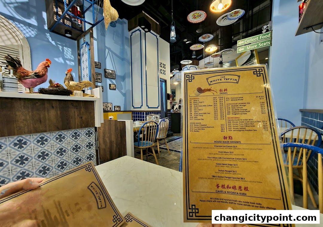 A menu from The White Tiffin restaurant, featuring drinks, desserts, and cakes.