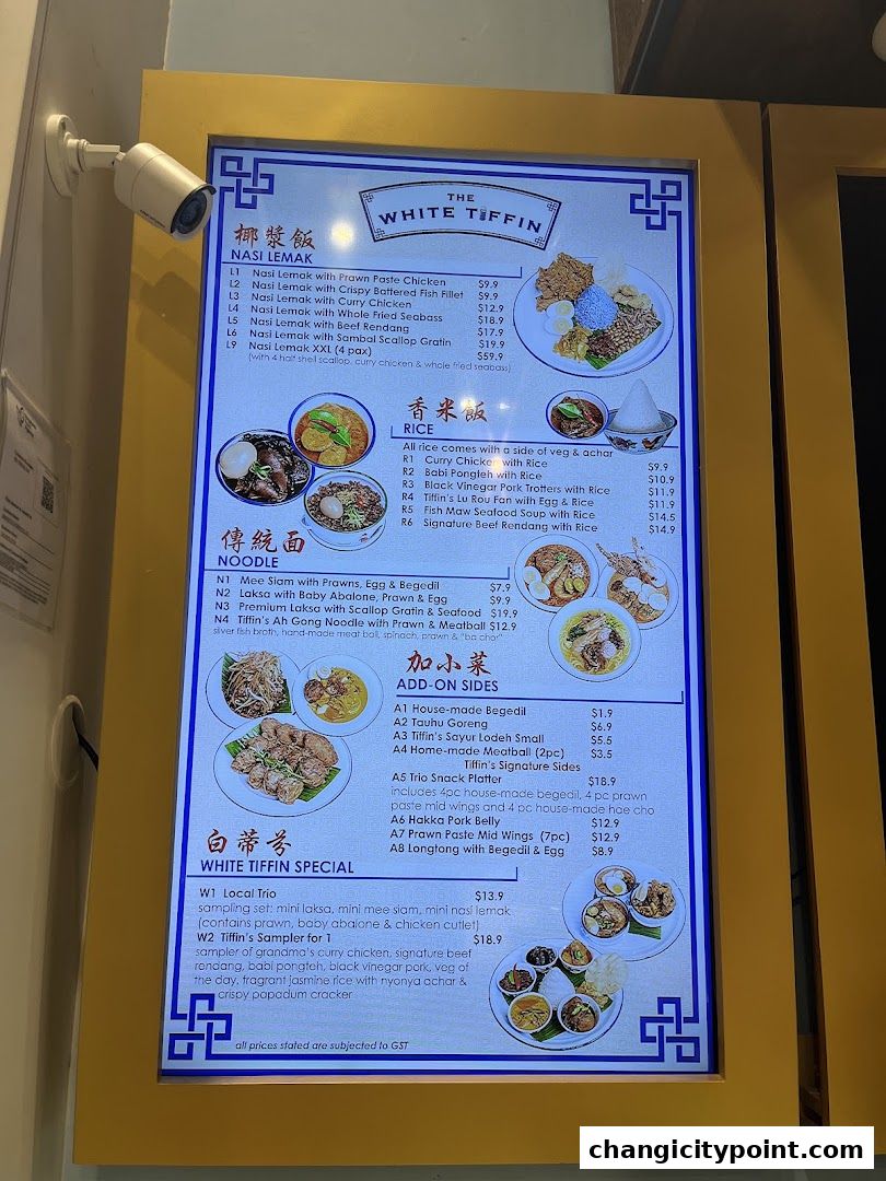 A digital menu board displaying various Nasi Lemak, Rice, Noodle, Add-on Sides, and Special dishes.