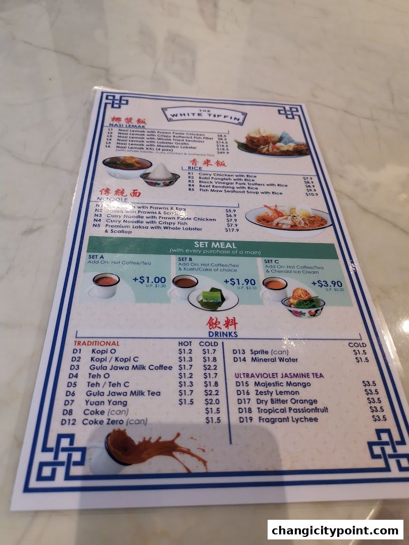 A menu from The White Tiffin featuring Nasi Lemak, Rice, Noodles, Set Meals, and Drinks.