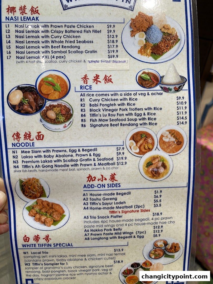 A menu from The White Tiffin featuring Nasi Lemak, Rice dishes, Noodles, Add-on Sides, and Specials.
