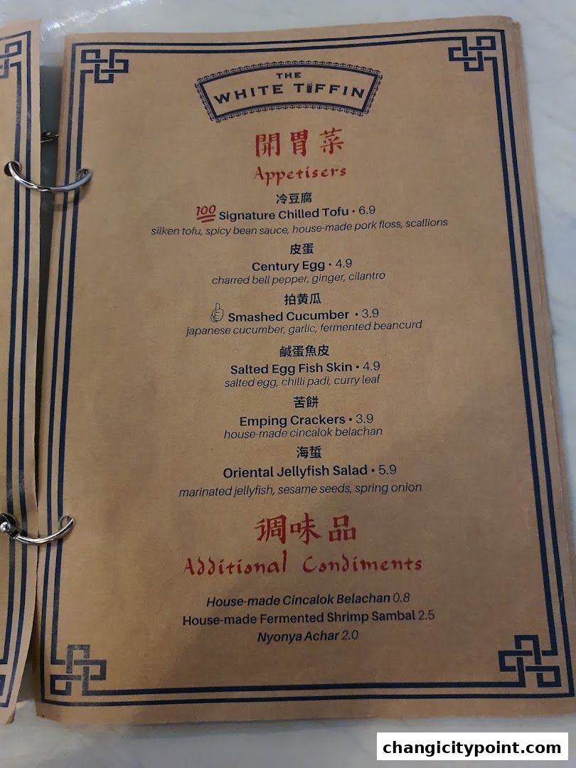 A menu from The White Tiffin featuring appetizers and condiments with prices.