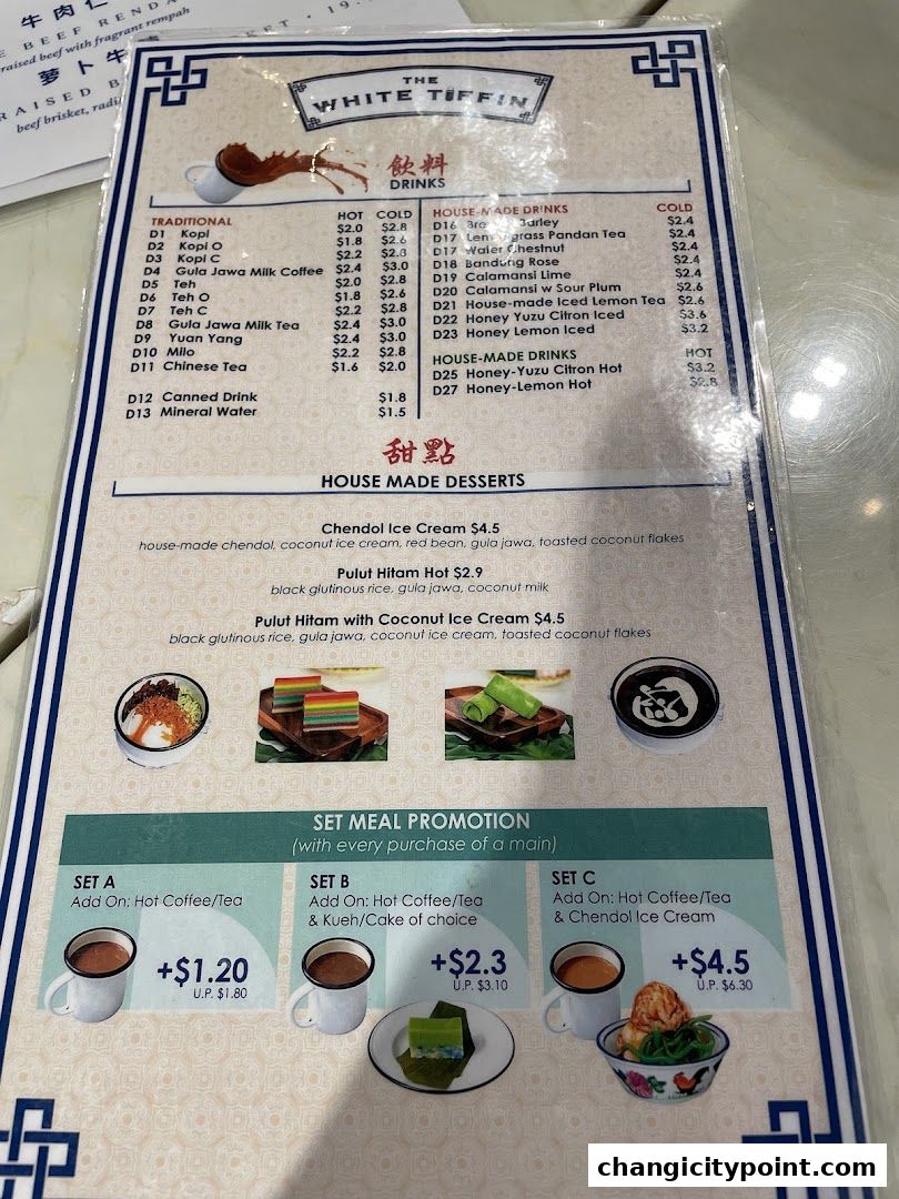 A menu from The White Tiffin featuring drinks and desserts with set meal promotions.