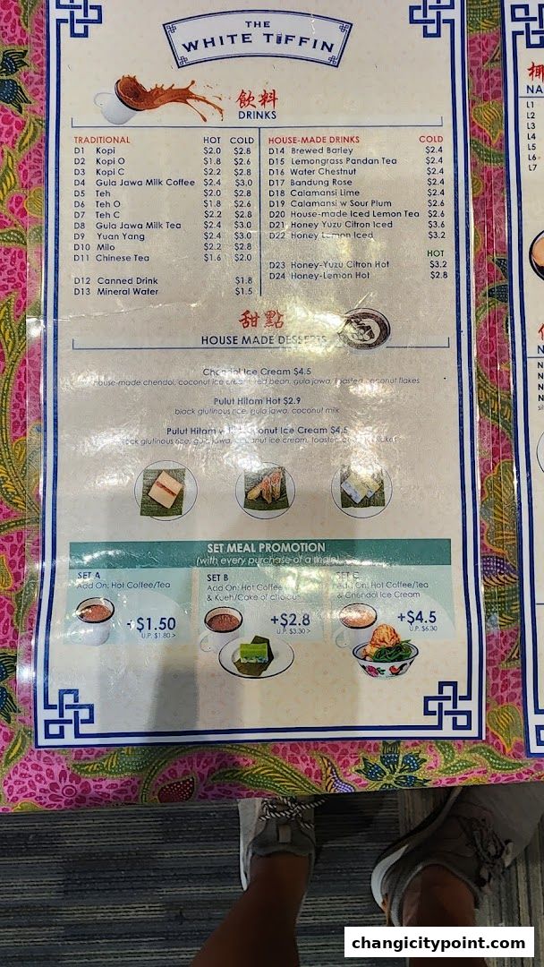 A menu from The White Tiffin featuring drinks, desserts, and set meal promotions.
