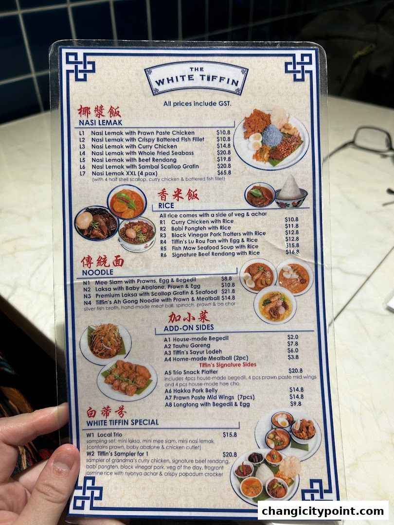 A menu from The White Tiffin restaurant featuring Nasi Lemak, Rice, Noodles, Add-on Sides, and Specials.
